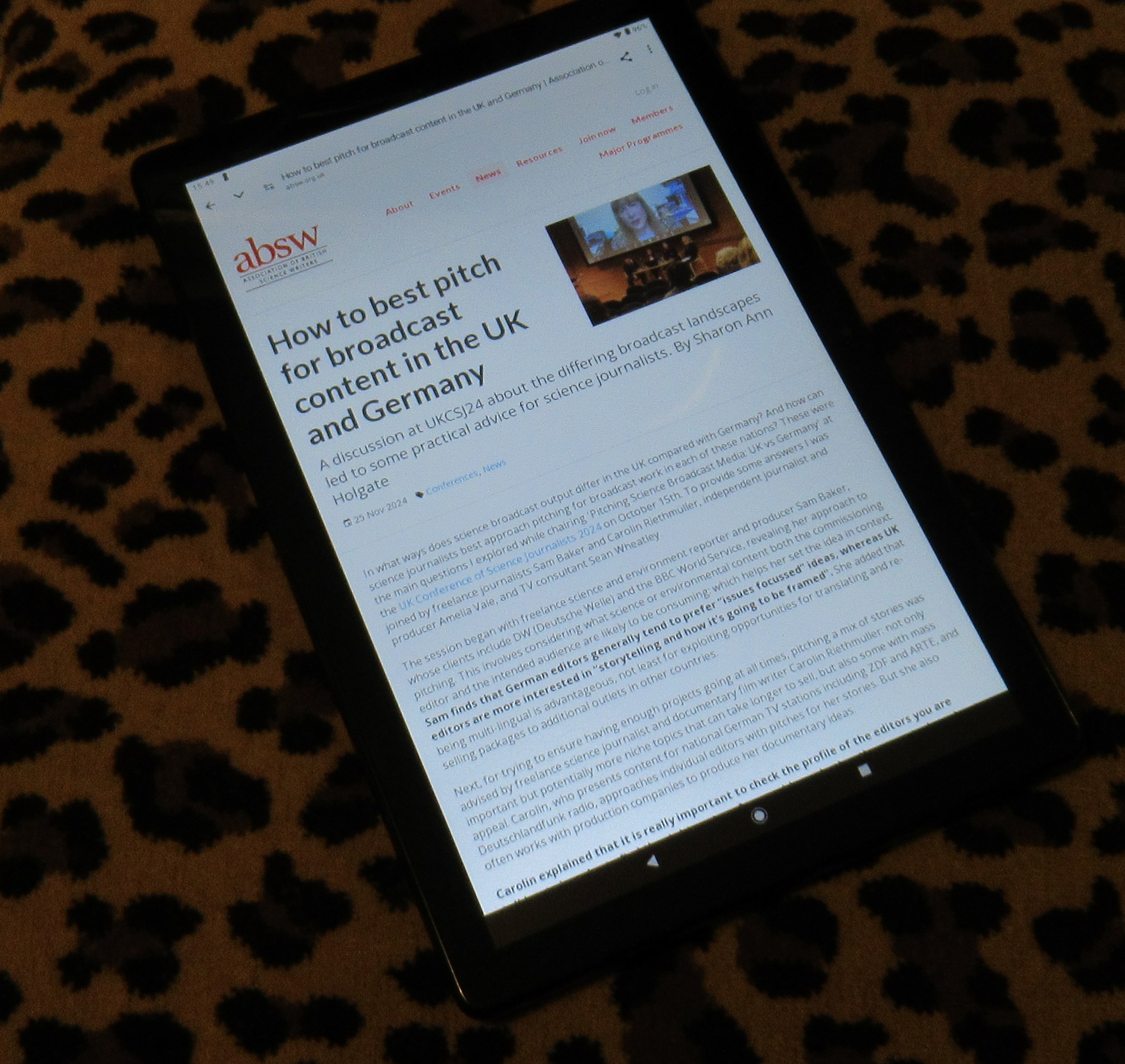 Photo of tablet showing the article on the ABSW website.